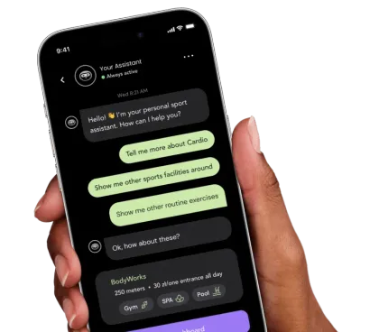 A hand holding a phone with the Rithm assistant chat